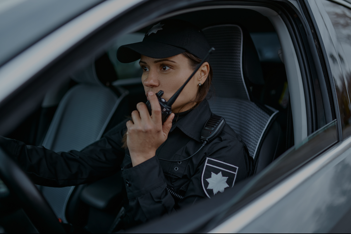 Mobile Patrol Lady Inside A Car Talking with WalkieTalkie